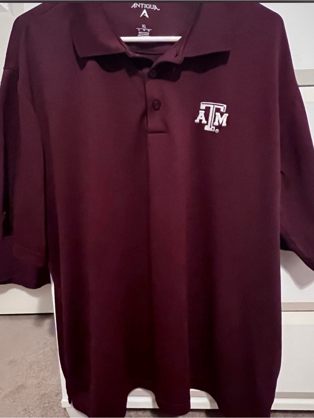 Antigua Men’s Maroon Polo with White Texas A&M Logo